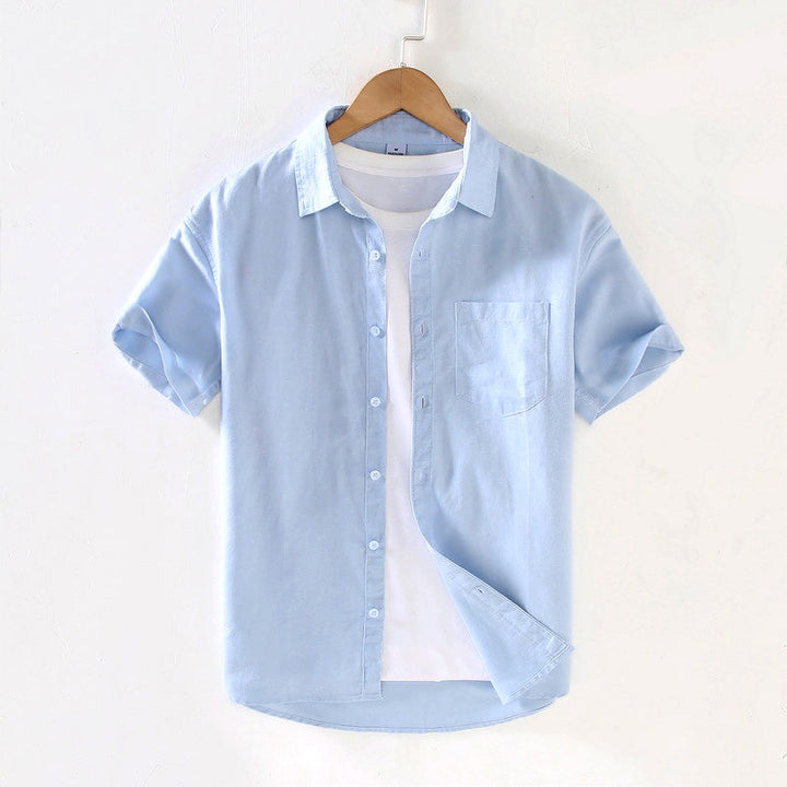 Classic men's short sleeve button-up shirt in breathable fabric, perfect for casual summer wear & everyday fashion.