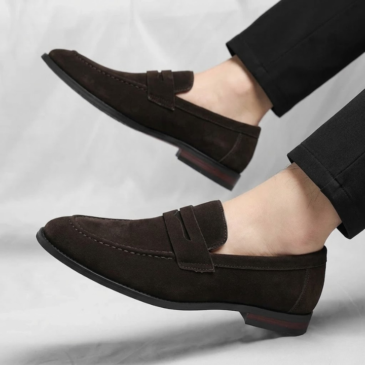 Versatile men's slip-on penny loafers, perfect for enhancing a casual outfit or a dressy ensemble.