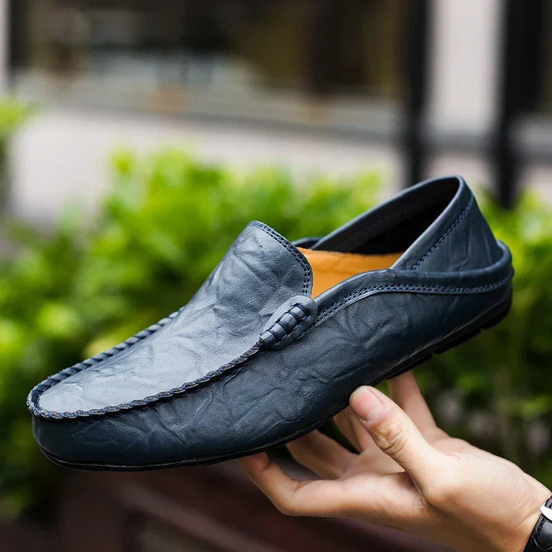 Classic men's slip-on loafers, elegant & comfortable for business casual or formal wear.