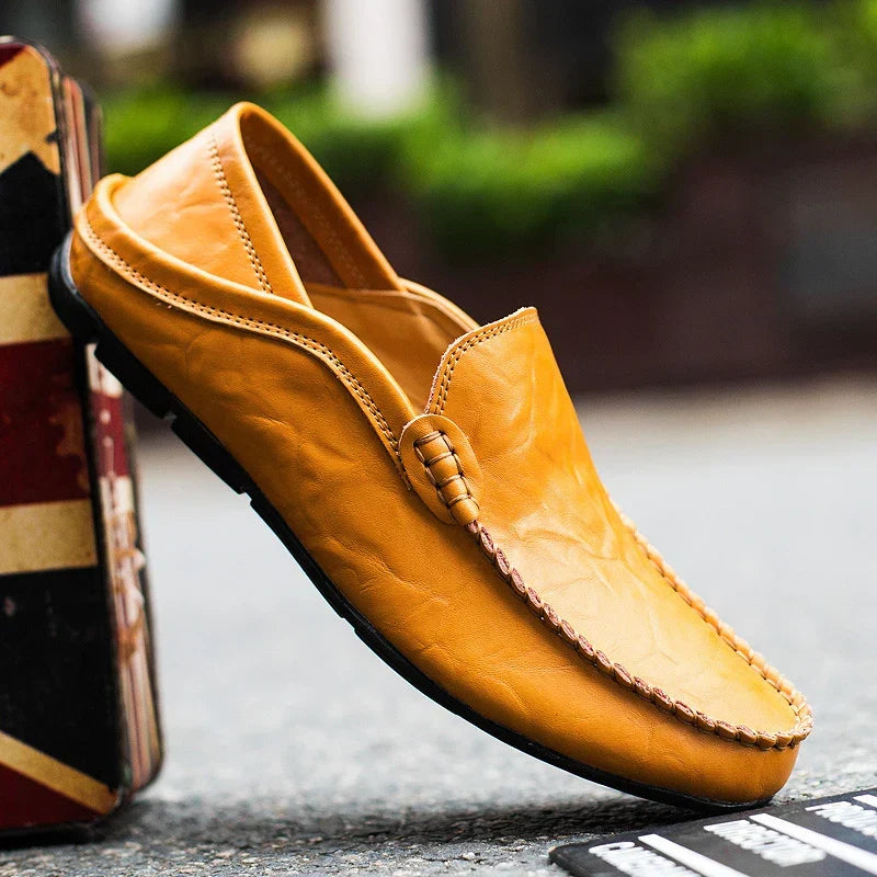 Modern men's slip-on loafers, a comfortable & stylish choice for versatile business fashion.