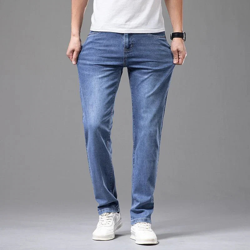 Casual men's straight fit stretch denim jeans, featuring a comfortable design and a versatile cotton blend material.