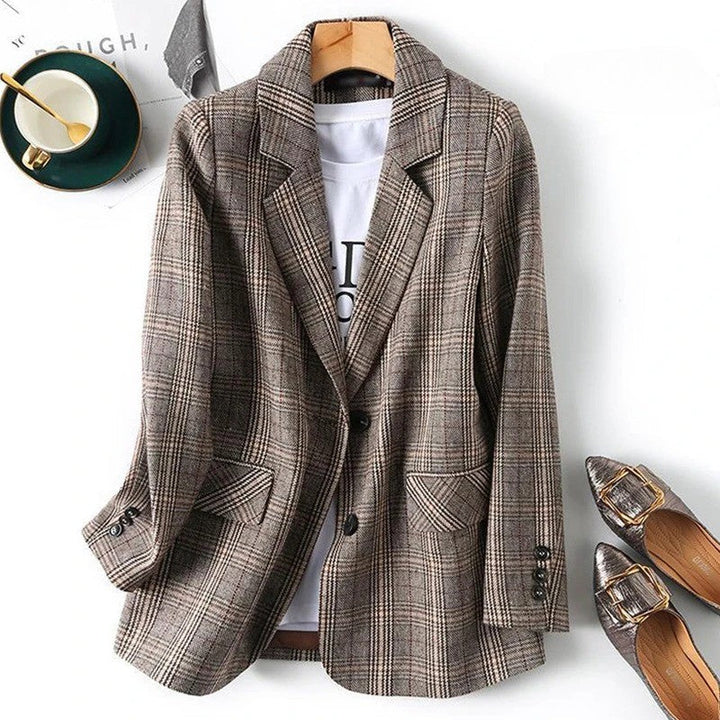 Classic men's tailored plaid blazer jacket, perfect for business or smart casual wear. Versatile outerwear.