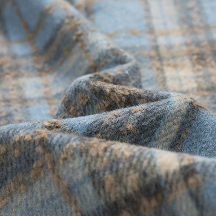 Stay warm and stylish in this classic plaid unisex winter jacket, ideal for cold weather.