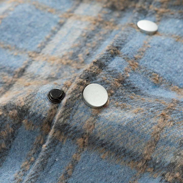 Durable plaid winter jacket, designed for warmth and classic style in cold weather.