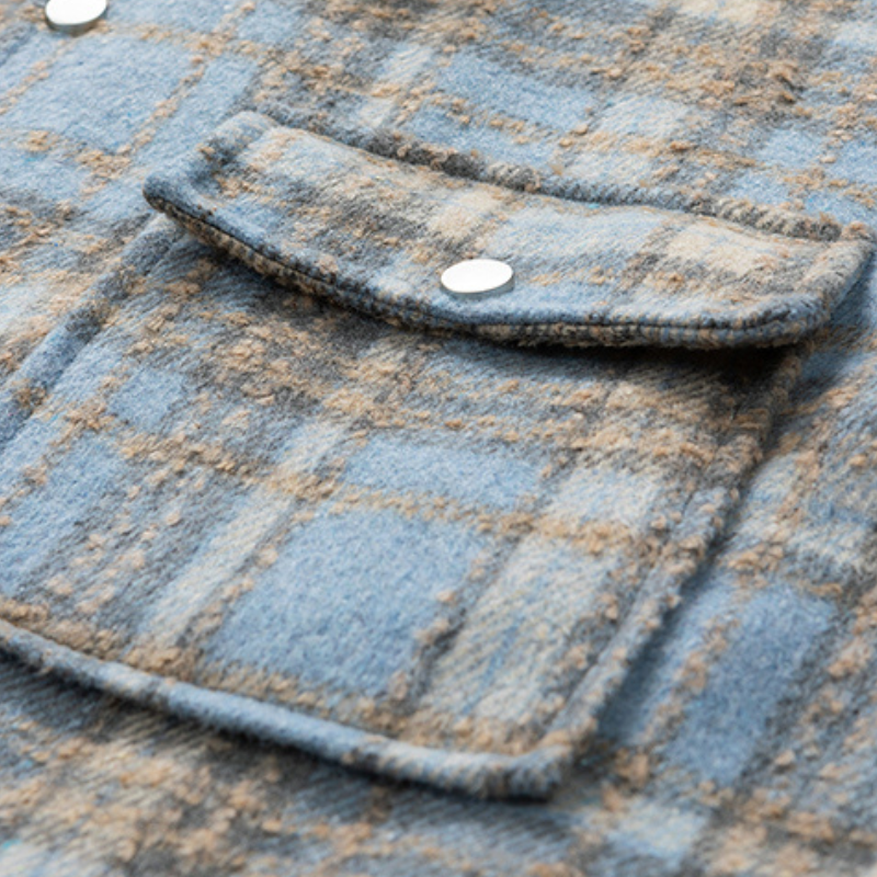 Layer up in this cozy plaid unisex winter jacket, a stylish choice for cold weather.