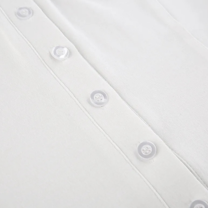 Essential white button-up shirt, a classic long sleeve women's blouse for versatile and chic fashion.