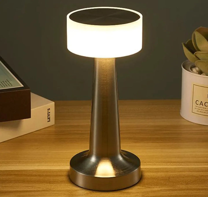 Home decor accent: a classic dimmable LED table lamp, wireless and portable for flexible lighting.