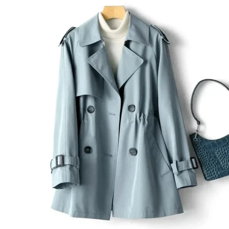 Stylish classic women's trench coat, double-breasted with belt, offering a chic look for office & everyday wear.