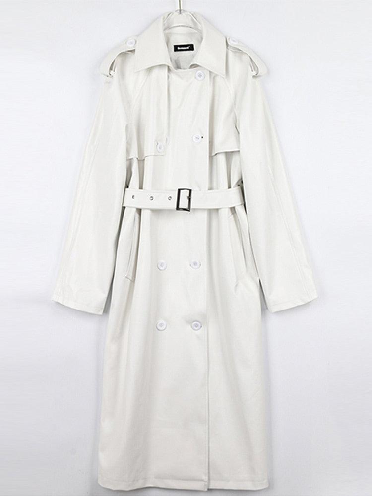 Fashionable women's trench coat. A stylish, long coat for a chic, layered look. Fall/winter essential.
