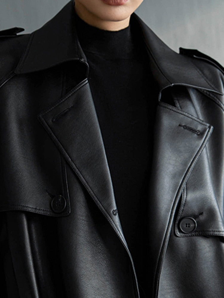 Oversized fit women's trench coat, offering chic style and warmth for cooler weather.