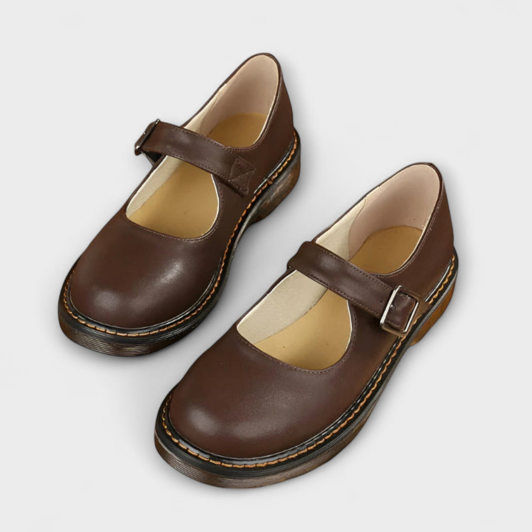 Classic women's Mary Jane flats with an adjustable buckle strap, perfect for comfortable everyday wear & versatile style.