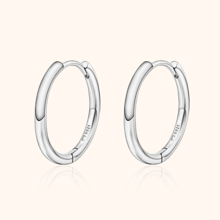 Classic women's sterling silver hoop earrings, perfect for everyday wear. Elegant and versatile jewelry.