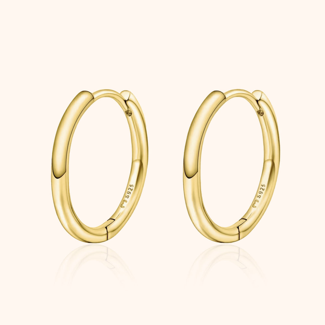 Elegant women's sterling silver classic hoop earrings. Lightweight & versatile, essential everyday jewelry for her.
