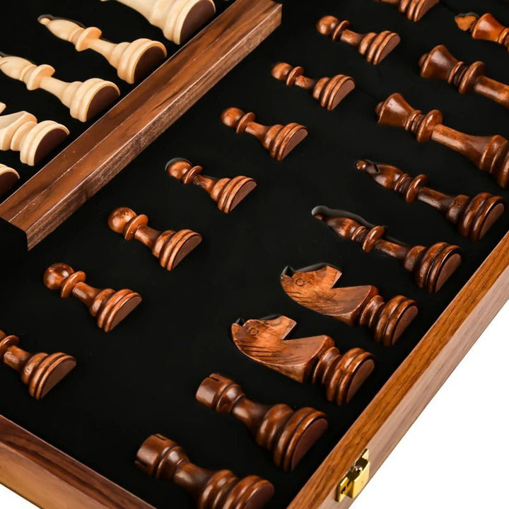 Portable wooden chess set; a classic game. Finely detailed wood pieces stored within the folding walnut board.