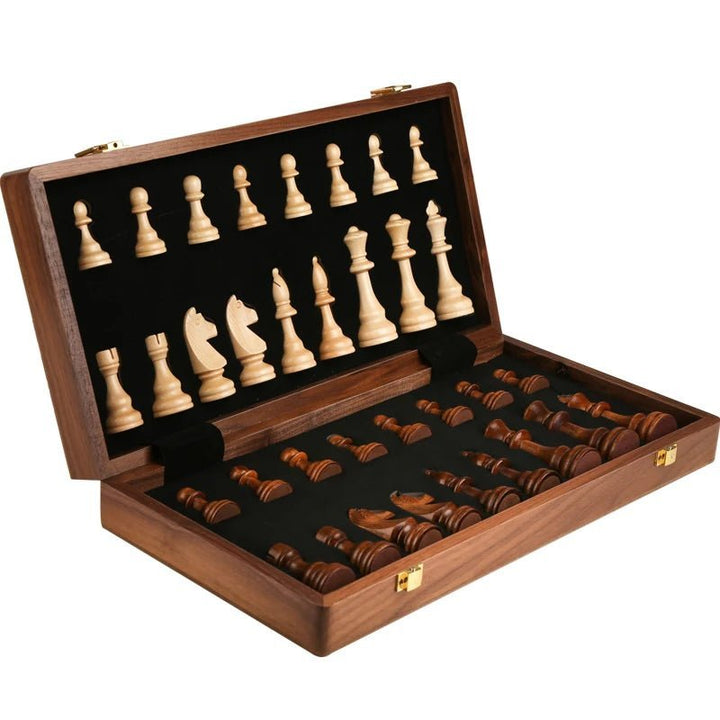 Close-up of the finely crafted wooden chess pieces from the classic walnut foldable board game set.
