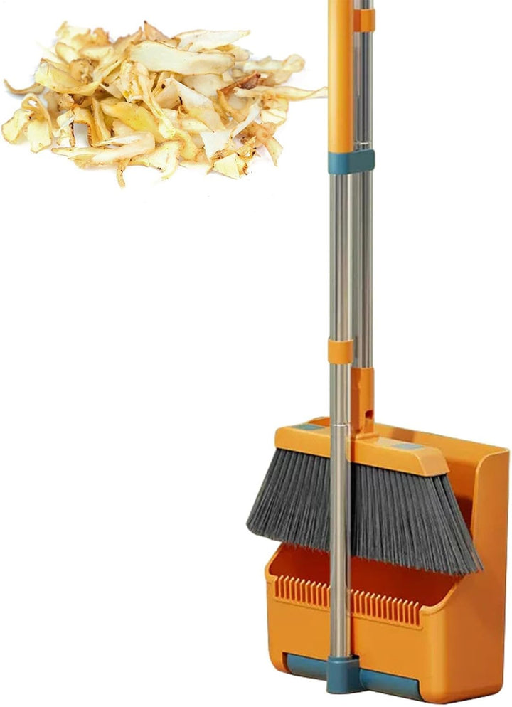 Clavira broom and dustpan set in a home environment, demonstrating its use for floor cleaning