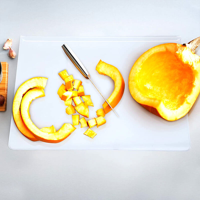 Stylish transparent non-slip serving board; perfect for modern kitchen food presentation.