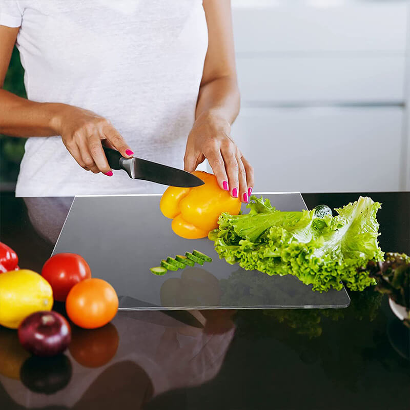 Versatile clear acrylic serving and cutting board; adds modern elegance to kitchen tasks.