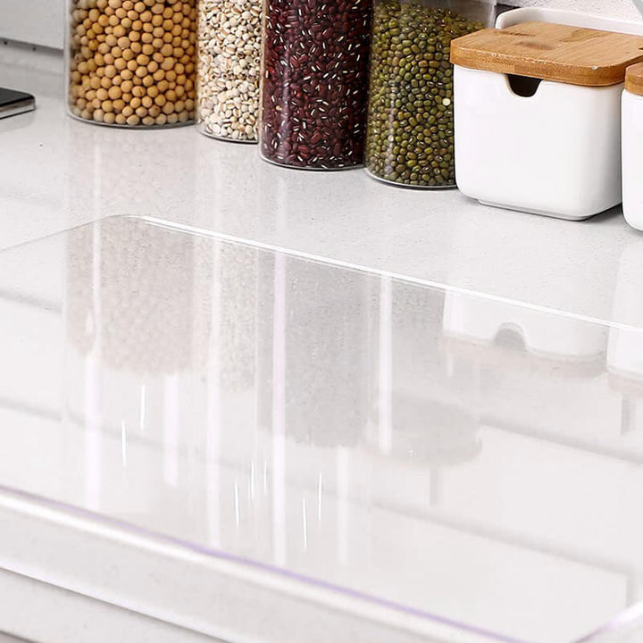 Crystal-clear non-slip acrylic cutting board; enhances safety and style in modern kitchens.
