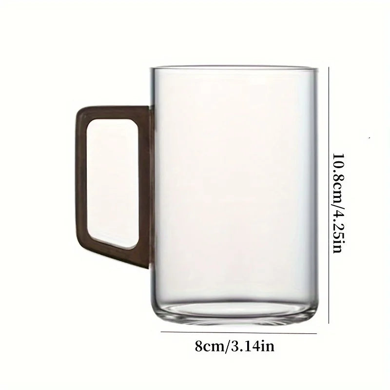 Unisex heat-resistant borosilicate glass tea cup with a unique natural wood handle for cozy sips.