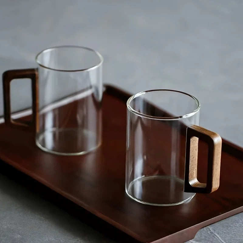 Modern borosilicate glass drinkware, a versatile coffee & tea mug with an attractive wood handle.