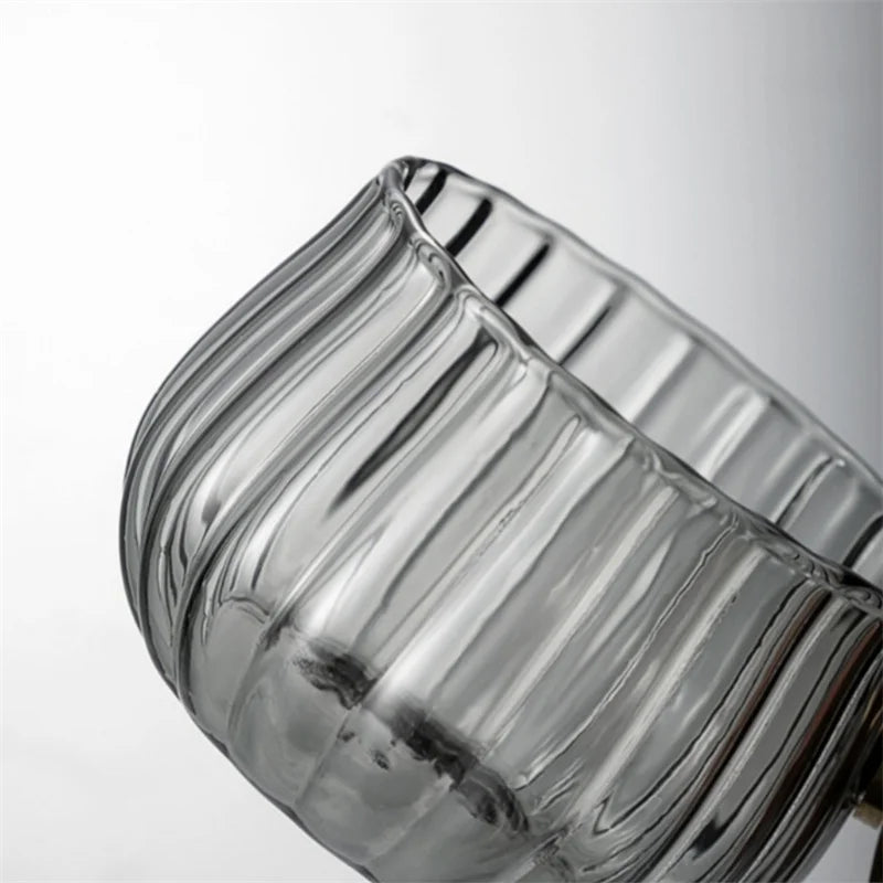 Durable borosilicate glass mug with unique wood handle, suitable for daily hot & cold use.