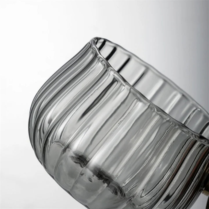 Durable borosilicate glass mug with unique wood handle, suitable for daily hot & cold use.