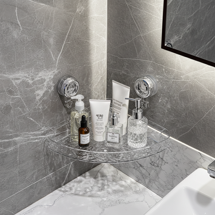 Clear suction cup wall organizer for seamless bathroom storage in damp areas, drill-free installation.