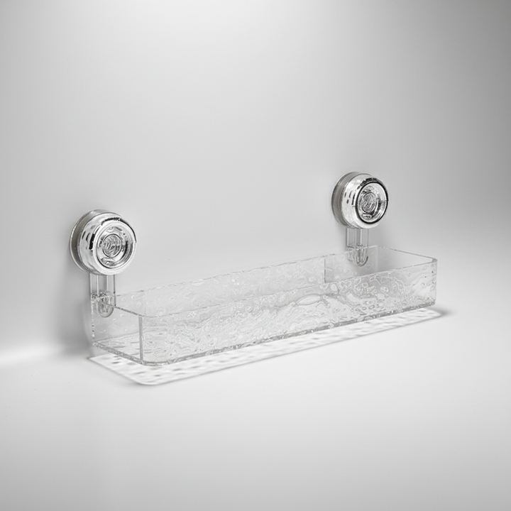 Compact clear wall-mounted caddy with powerful suction, enhancing kitchen and bathroom space.
