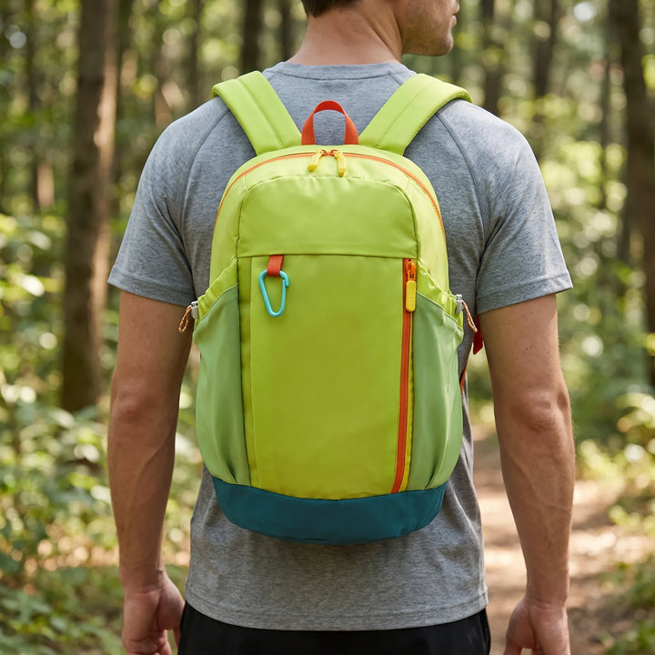 Close-up of a blue lightweight hiking daypack, showing durable fabric & zippers for outdoor adventures.