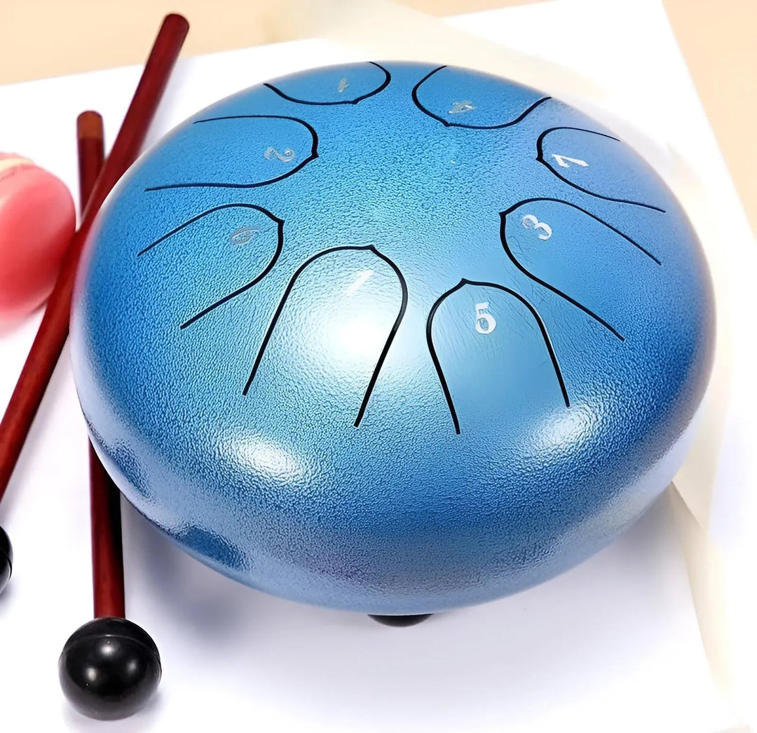 Beautiful steel tongue drum for meditation, producing calming tones; a unique gift for all.