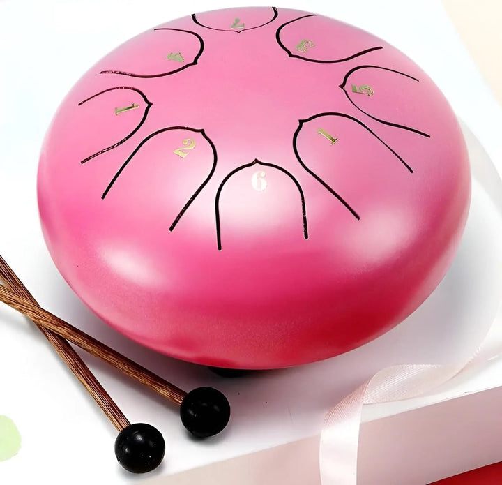 Top-down view of a durable carbon steel tongue drum, excellent for beginners & pros.