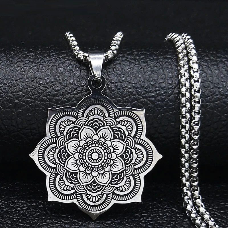 Close-up of a delicate sterling silver lotus blossom pendant, symbolizing purity and elegance on a women's necklace.