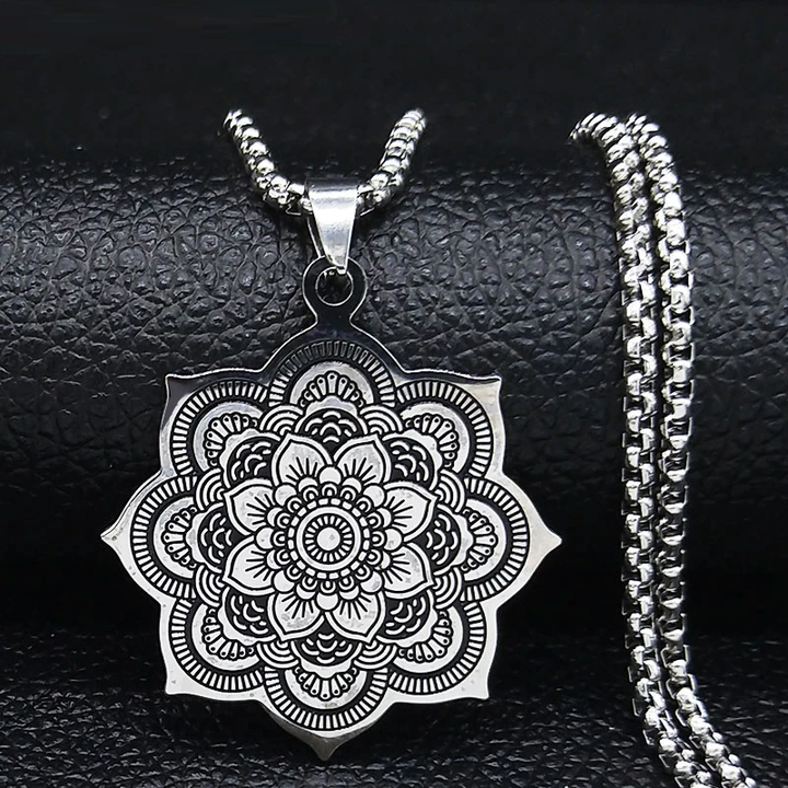 Close-up of a delicate sterling silver lotus blossom pendant, symbolizing purity and elegance on a women's necklace.
