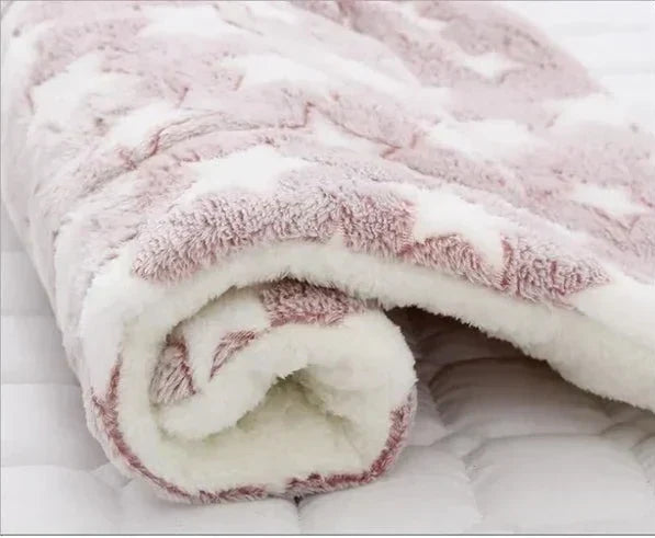Machine washable SnuggleSoft warming pet blanket, ideal for cozy cat naps & feline comfort. Soft flannel fabric.