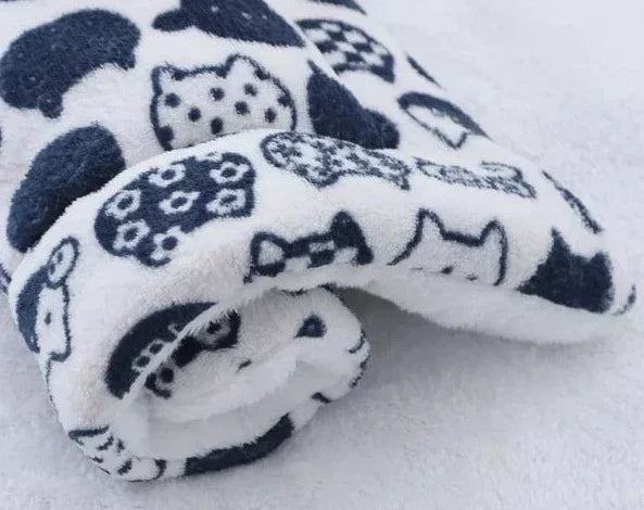 A SnuggleSoft warming pet blanket designed for cats. Ultra-soft flannel, machine washable for easy pet care.