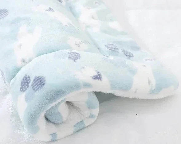 View of the SnuggleSoft warming cat blanket, made from soft flannel, ensuring a warm & cozy space for your feline.