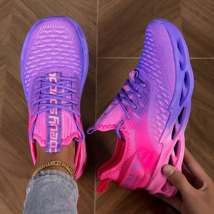 Close-up of a women's walking sneaker, highlighting its flexible sole & breathable mesh for daily wear.