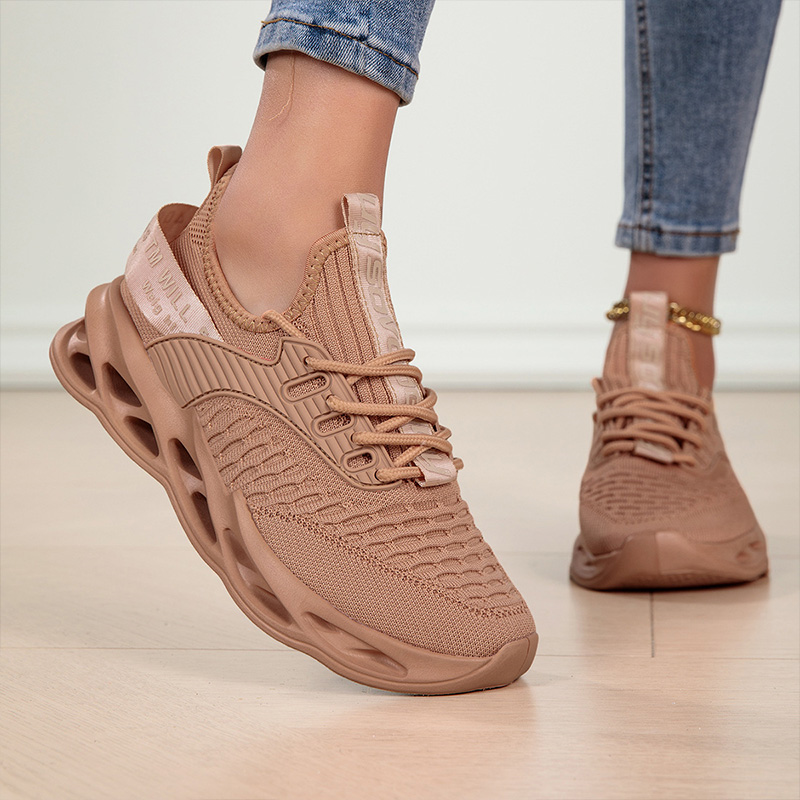 Top-down view of women's lace-up activewear sneakers, highlighting their sleek design for daily use.