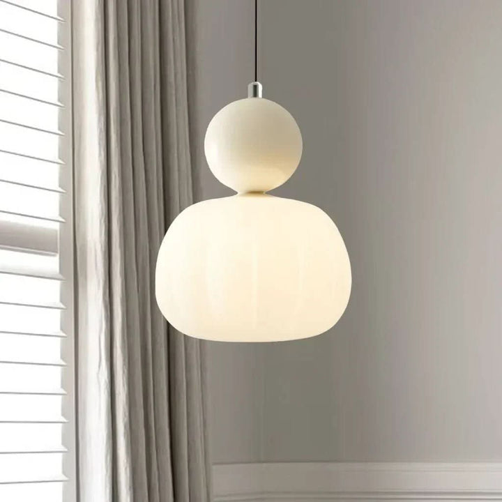 Close-up of elegant Art Deco pendant light with geometric design, perfect for modern dining rooms.