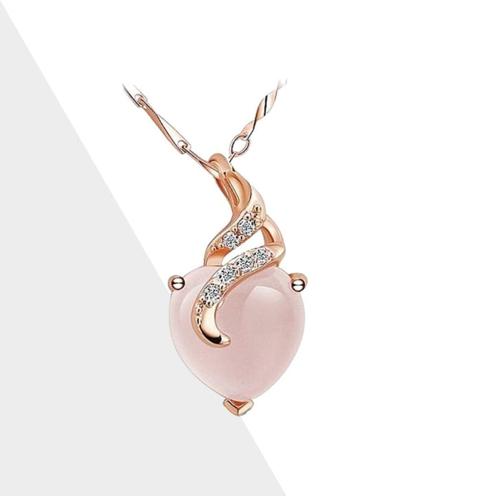 Close-up of elegant Calista women's opal heart necklace in shimmering rose gold, perfect gift for her.