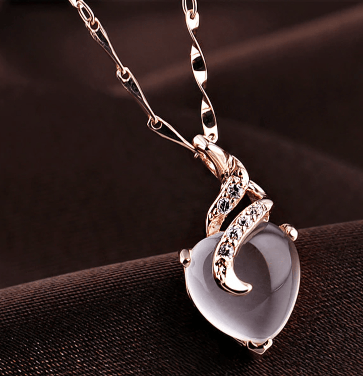 Women's Calista opal heart necklace, a timeless piece of elegant heart jewelry in rose gold.