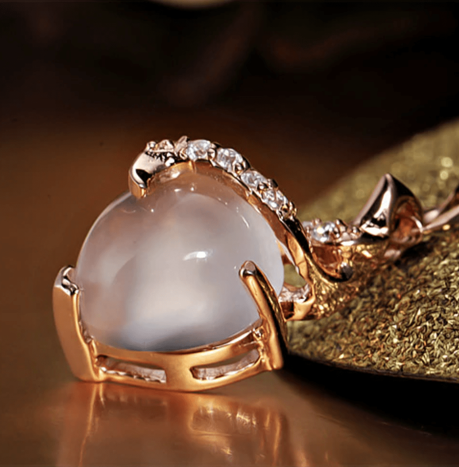 Delicate women's opal heart necklace, Calista design, available in rose gold or silver, fine jewelry.