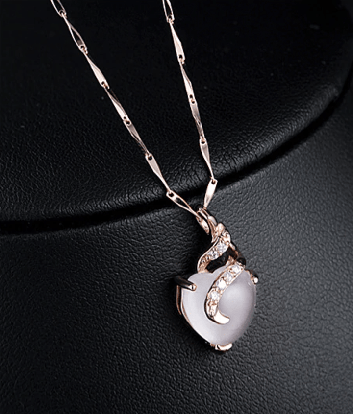 Women's elegant opal heart necklace, Calista collection, stunning opal gemstone for a sophisticated look.