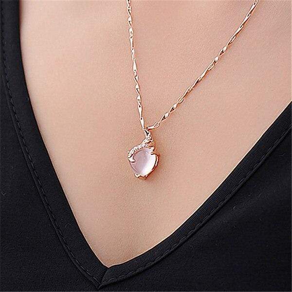 Beautiful silver opal heart necklace for women, intricate Calista design, fine jewelry piece.