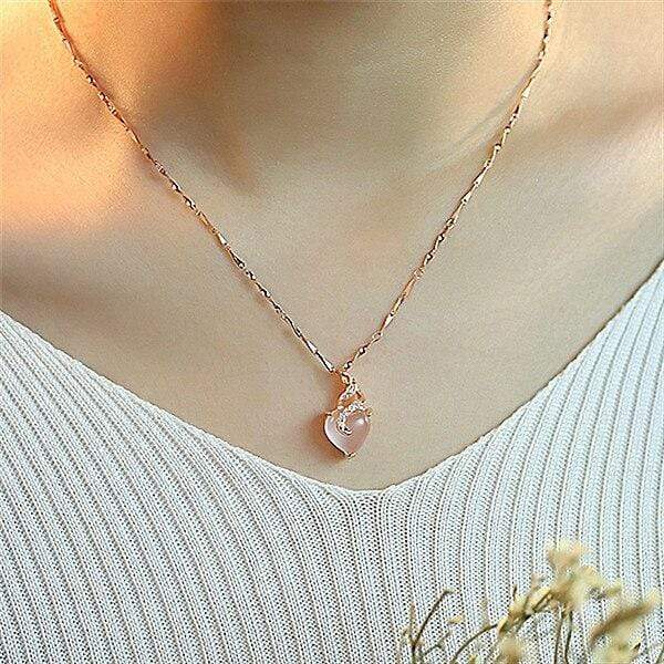 Gift-ready women's opal heart necklace in rose gold, exquisite Calista design, symbolic and fine jewelry.