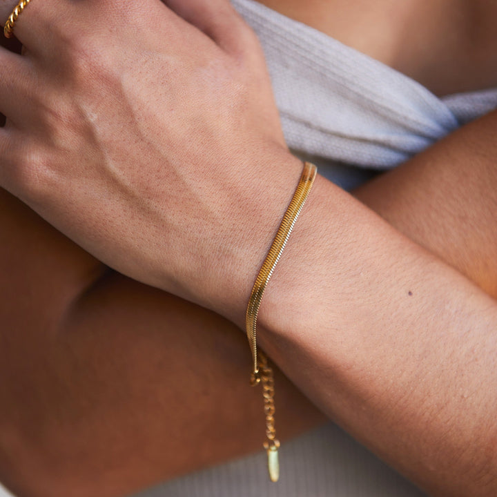 Detail shot of silver herringbone chain bracelet, a beautiful women's jewelry gift.