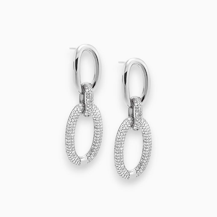 Elegant women's sparkling stud earrings, Luxe Sparkle Aurora in gold, highlighting the brilliant gemstones and fashionable design