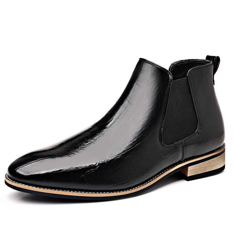 Full shot of men's polished black slip-on Chelsea boots, a staple for modern men's footwear.