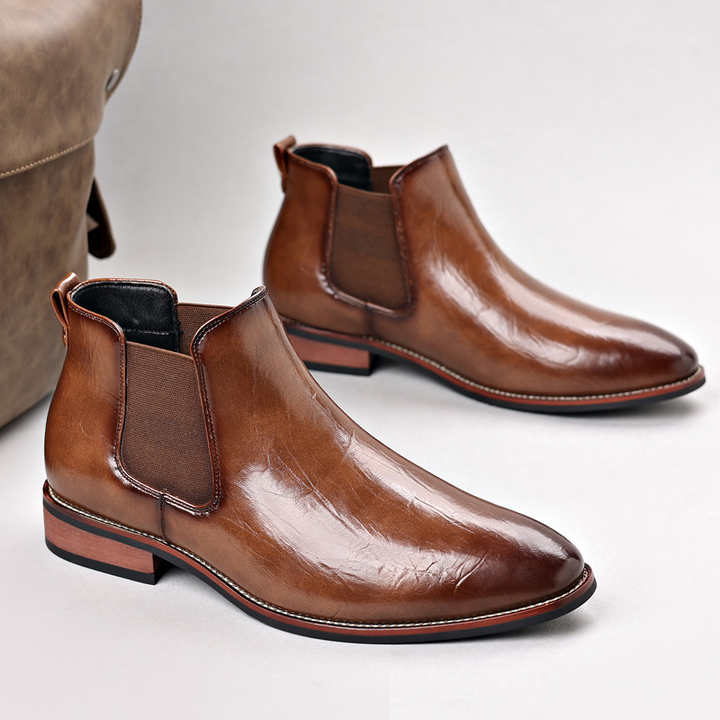 Stylish men's brown polished leather Chelsea boots, comfortable for all-day wear & everyday style.
